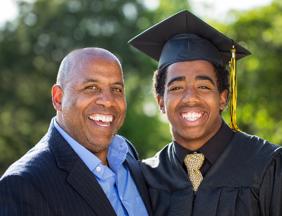 A proud parent with their graduate